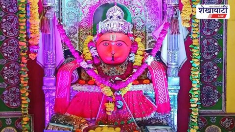 Devotees carrying Nishan flags during Hanuman Janmotsav procession Jhunjhunu