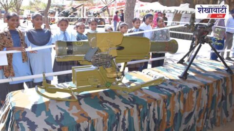 Visitors exploring Indian Army military equipment exhibition in Churu stadium
