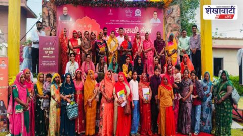 Women receiving tablets at Rajsakhi fair in Churu Rajasthan