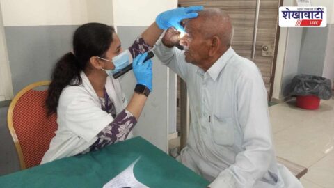 Doctors examining patients at free medical camp in Udaipurwati town hall