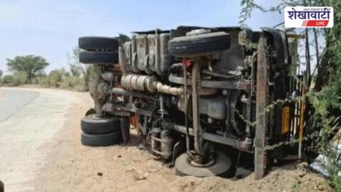 Overturned truck Sardarshahar highway spilled material road traffic blocked