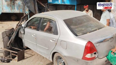 Damaged car after crashing near Sadulpur bus stand roadside stalls