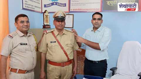 Police officers honor Tarachand Jangid after SI promotion in Surajgarh