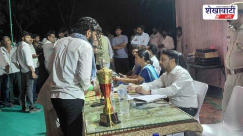 ADM interacting with villagers during night chaupal in Sikar village