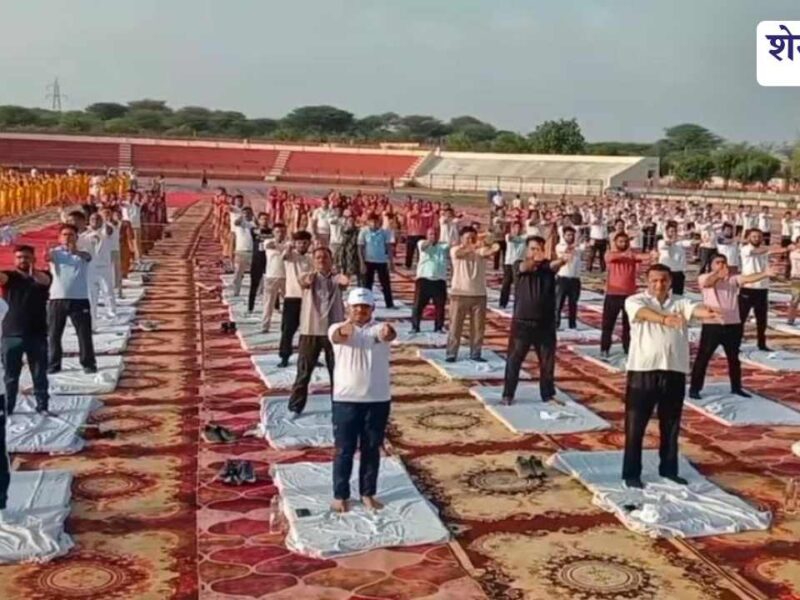 People performing yoga at Churu district sports stadium