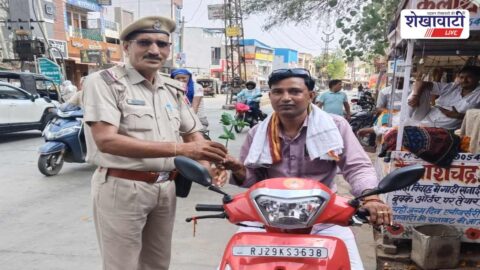 Traffic police giving roses to helmetless riders in Chirawa