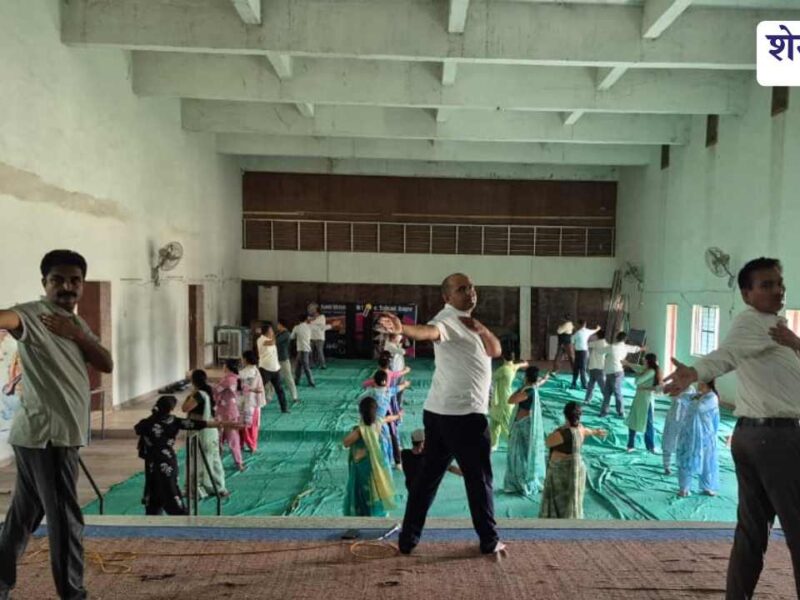 Students and teachers performing yoga at Bagad school