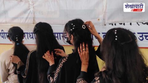 Students participating in hair style competition at Sikar camp